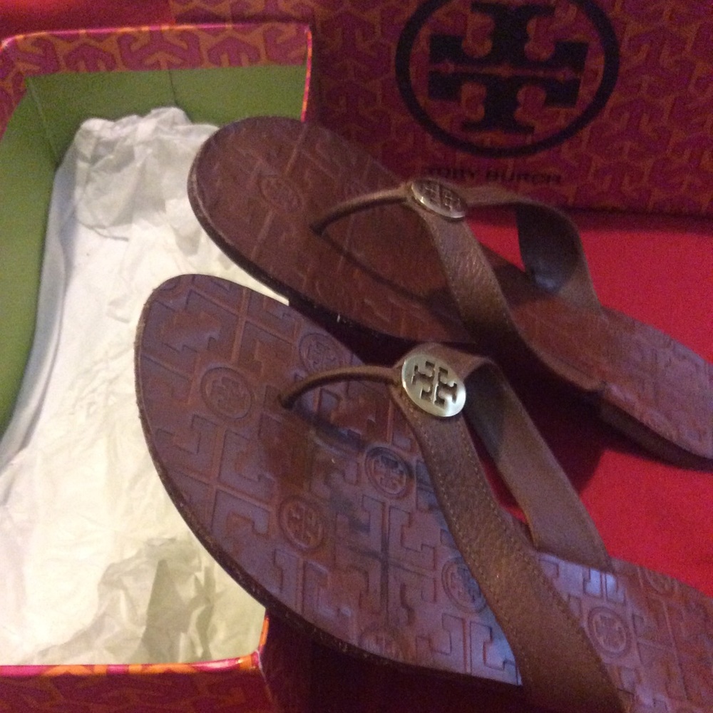 Tan Leather flats with a gold TB hardware.